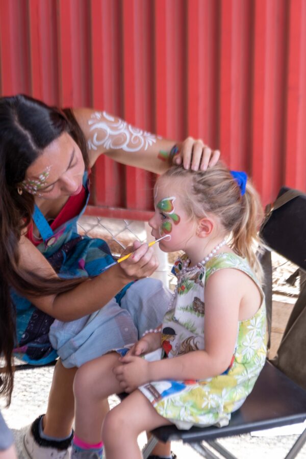 A girl getting her face painted