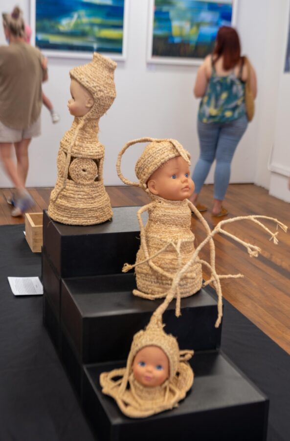 Artworks made out of dolls and raffia